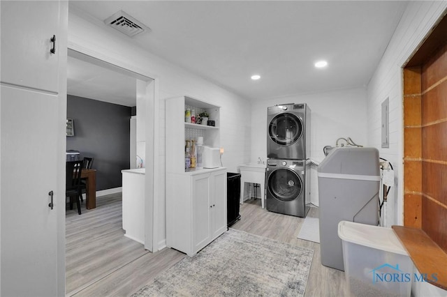 26237 Luckey Rd, Walbridge, OH 43465 - laundry area with stacked washer / dryer, laundry area, visible vents, recessed lighting, and light wood finished floors