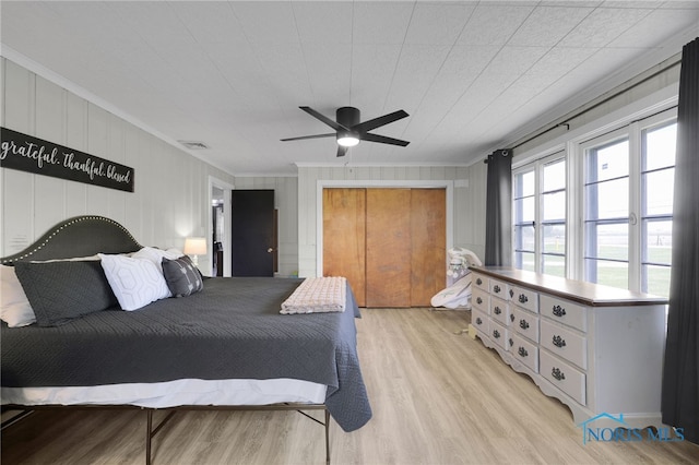 26237 Luckey Rd, Walbridge, OH 43465 - bedroom with light wood finished floors, visible vents, and crown molding