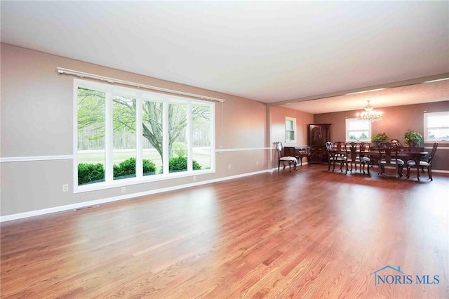 1440 N State Route 19, Republic, OH 44867 - living area with baseboards, visible vents, wood finished floors, and a chandelier
