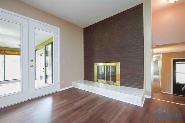 1440 N State Route 19, Republic, OH 44867 - entryway featuring baseboards, a tiled fireplace, and wood finished floors