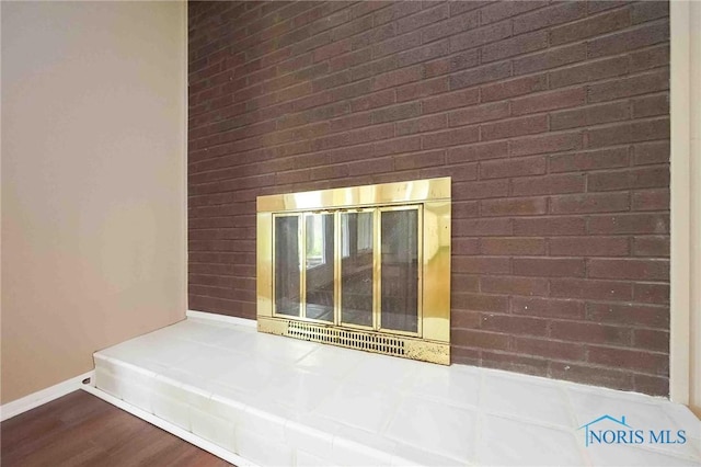 interior space featuring baseboards and wood finished floors