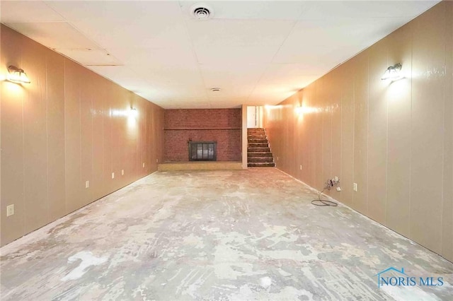 1440 N State Route 19, Republic, OH 44867 - finished below grade area with visible vents, wooden walls, a fireplace, and stairway