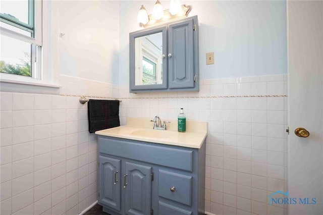 1440 N State Route 19, Republic, OH 44867 - bathroom featuring vanity, wainscoting, and tile walls