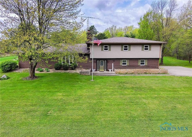 1440 N State Route 19, Republic, OH 44867 - split level home with brick siding and a front lawn