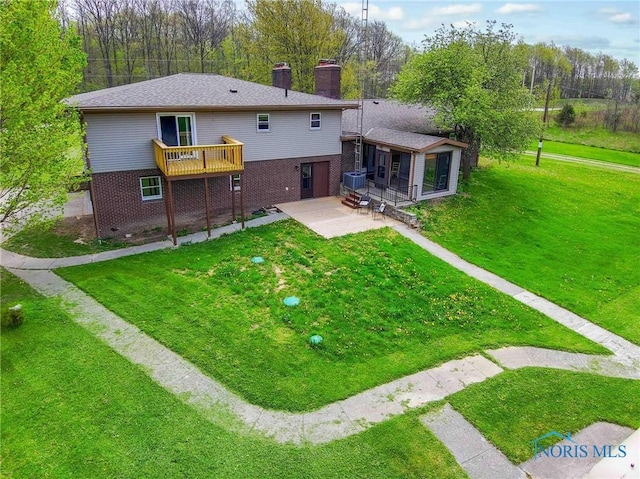 1440 N State Route 19, Republic, OH 44867 - back of property featuring brick siding, a patio area, a lawn, and a chimney