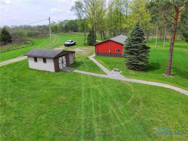 1440 N State Route 19, Republic, OH 44867 - view of yard featuring an outdoor structure, a pole building, and a detached garage