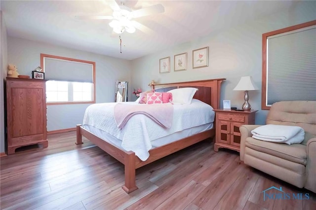2028 Lakeland Dr, Findlay, OH 45840 - bedroom featuring baseboards, ceiling fan, and light wood-style flooring