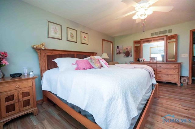 2028 Lakeland Dr, Findlay, OH 45840 - bedroom with a ceiling fan, wood finished floors, and visible vents