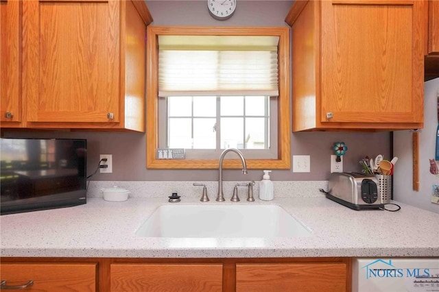 2028 Lakeland Dr, Findlay, OH 45840 - kitchen featuring a sink and light stone countertops