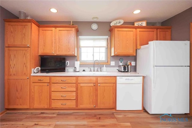 2028 Lakeland Dr, Findlay, OH 45840 - kitchen featuring recessed lighting, a sink, white appliances, and light countertops