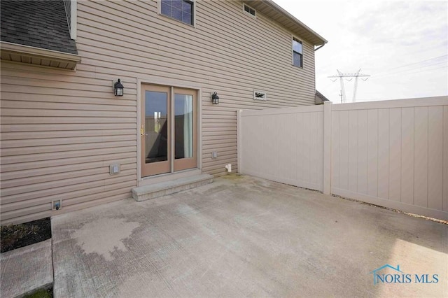 view of patio featuring fence