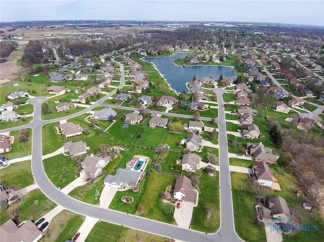 bird's eye view with a water view and a residential view