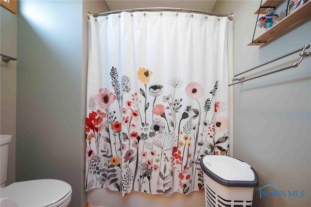 bathroom featuring toilet