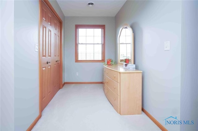 2028 Lakeland Dr, Findlay, OH 45840 - hall with baseboards, light carpet, and visible vents