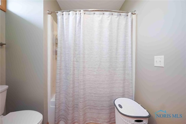 2028 Lakeland Dr, Findlay, OH 45840 - bathroom with shower / bath combination with curtain and toilet