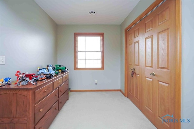 2028 Lakeland Dr, Findlay, OH 45840 - bedroom featuring baseboards, light carpet, and visible vents