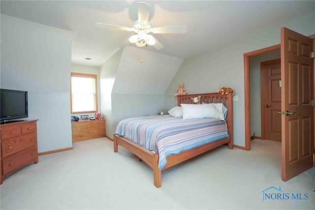 2028 Lakeland Dr, Findlay, OH 45840 - bedroom with a ceiling fan, baseboards, vaulted ceiling, and light carpet
