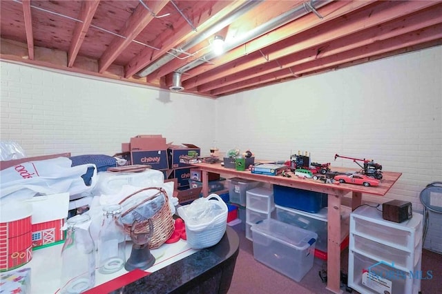 unfinished below grade area with brick wall
