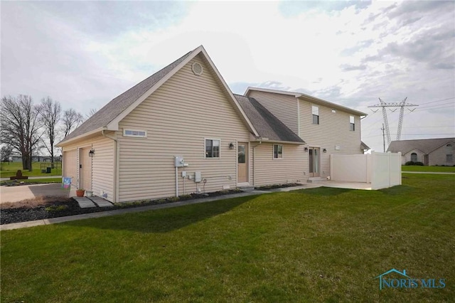 2028 Lakeland Dr, Findlay, OH 45840 - rear view of property featuring roof with shingles and a yard