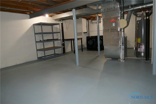 6553 Abbey Run Unit D13, Sylvania, OH 43560 - unfinished basement featuring heating unit, gas water heater, and washer and dryer