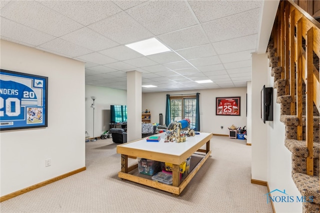 game room with baseboards, carpet, and a paneled ceiling