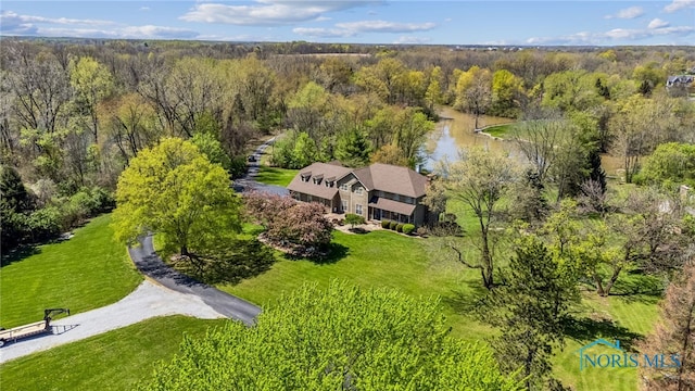 aerial view featuring a water view and a view of trees