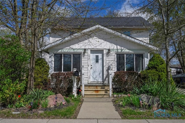 bungalow-style home with entry steps