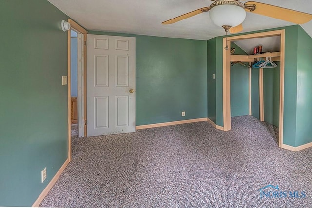 unfurnished bedroom featuring carpet floors, a ceiling fan, baseboards, and a closet