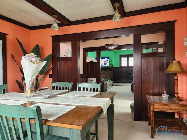 602 W Main St, Fayette, OH 43521 - dining space featuring carpet floors, beam ceiling, ornamental molding, a textured ceiling, and a baseboard radiator