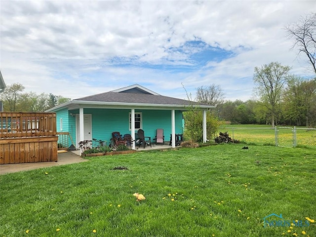 602 W Main St, Fayette, OH 43521 - back of property featuring a shingled roof and a wooden deck
