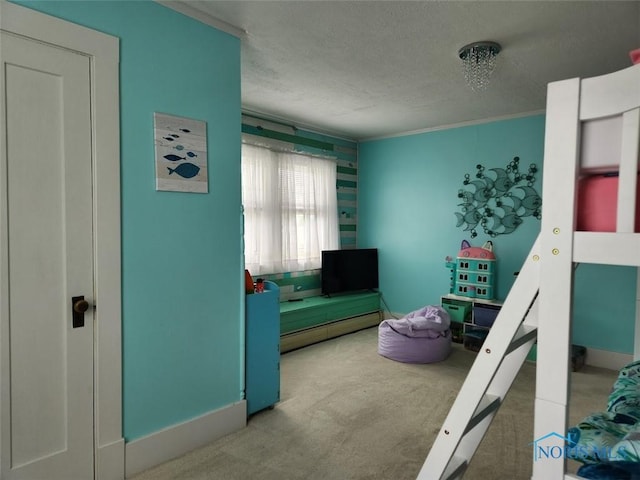 602 W Main St, Fayette, OH 43521 - carpeted bedroom featuring a textured ceiling, ornamental molding, and baseboards
