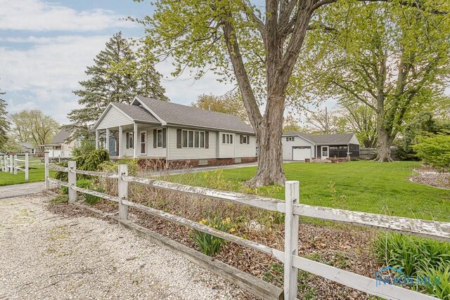 ranch-style home with a front lawn, a fenced front yard, roof with shingles, and crawl space