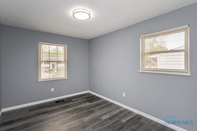 2509 Orchard Hills Blvd, Toledo, OH 43615 - empty room with baseboards and dark wood-type flooring