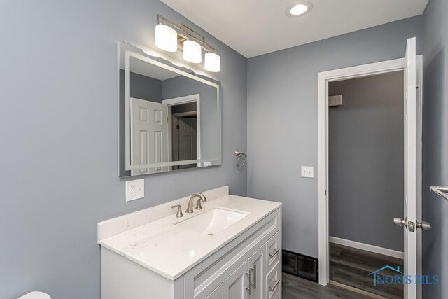 2509 Orchard Hills Blvd, Toledo, OH 43615 - bathroom featuring wood finished floors, vanity, and baseboards