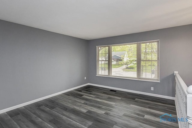 2509 Orchard Hills Blvd, Toledo, OH 43615 - spare room with baseboards and dark wood-type flooring