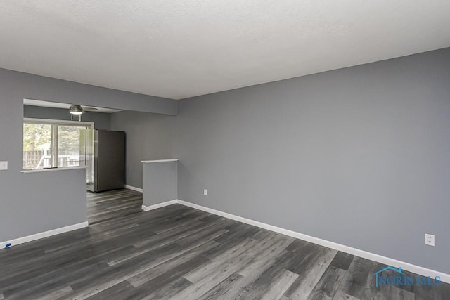 2509 Orchard Hills Blvd, Toledo, OH 43615 - unfurnished room featuring dark wood-style flooring, baseboards, and a ceiling fan