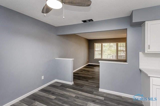 2509 Orchard Hills Blvd, Toledo, OH 43615 - unfurnished dining area with dark wood-style floors, baseboards, and ceiling fan