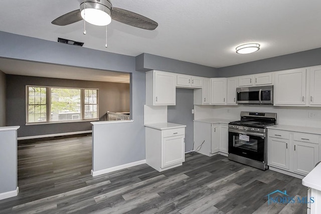 2509 Orchard Hills Blvd, Toledo, OH 43615 - kitchen featuring appliances with stainless steel finishes, dark wood-style floors, and white cabinets