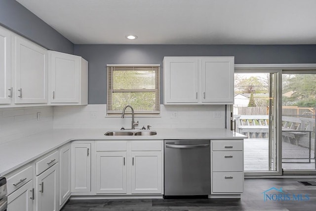 2509 Orchard Hills Blvd, Toledo, OH 43615 - kitchen featuring stainless steel dishwasher, a sink, white cabinetry, tasteful backsplash, and recessed lighting