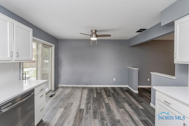2509 Orchard Hills Blvd, Toledo, OH 43615 - kitchen with stainless steel dishwasher, white cabinets, a ceiling fan, light countertops, and wood finished floors