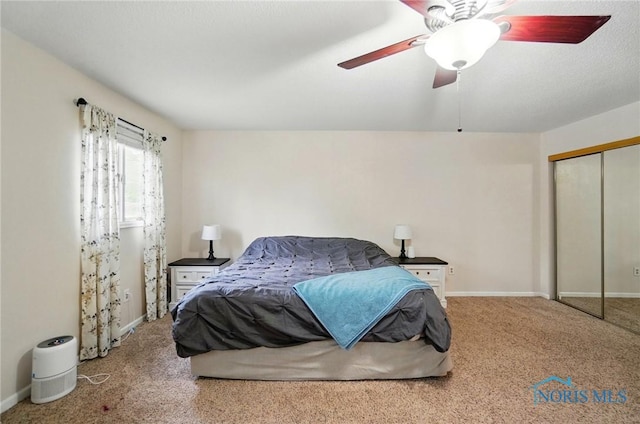 2369 Saint James Woods Blvd, Toledo, OH 43617 - carpeted bedroom featuring a closet, baseboards, and ceiling fan
