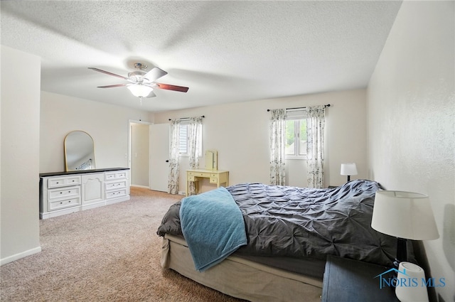 2369 Saint James Woods Blvd, Toledo, OH 43617 - bedroom featuring carpet, ceiling fan, a textured ceiling, and baseboards