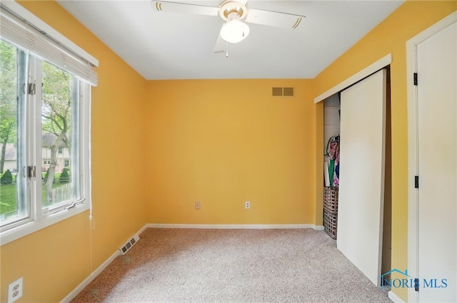 2369 Saint James Woods Blvd, Toledo, OH 43617 - unfurnished bedroom featuring carpet, a closet, baseboards, and a ceiling fan