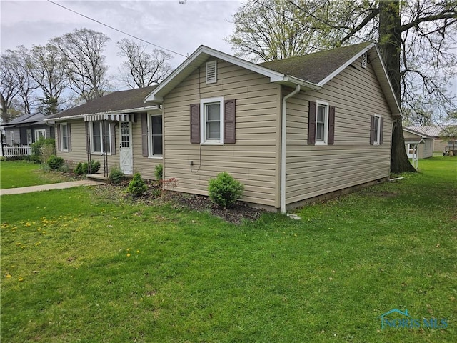 107 Superior St, Oakwood, OH 45873 - single story home with a shingled roof and a front lawn