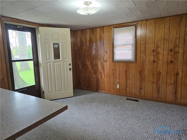 107 Superior St, Oakwood, OH 45873 - carpeted foyer featuring wooden walls and visible vents