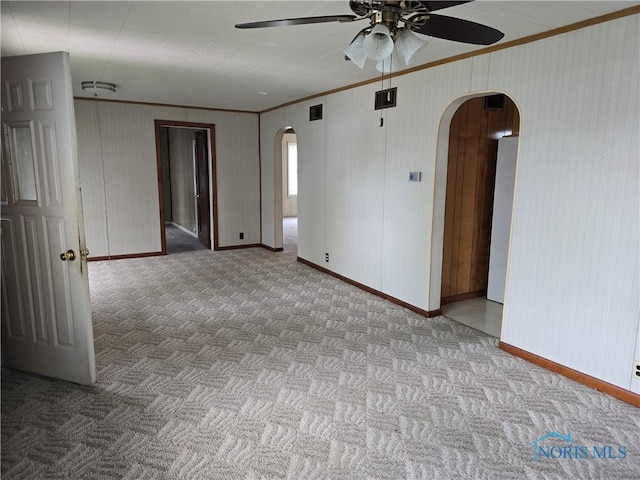 107 Superior St, Oakwood, OH 45873 - carpeted spare room featuring arched walkways, ceiling fan, visible vents, and ornamental molding