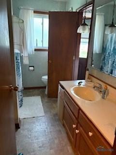 1805 Ayersville Ave, Defiance, OH 43512 - full bathroom with healthy amount of natural light, toilet, vanity, and curtained shower