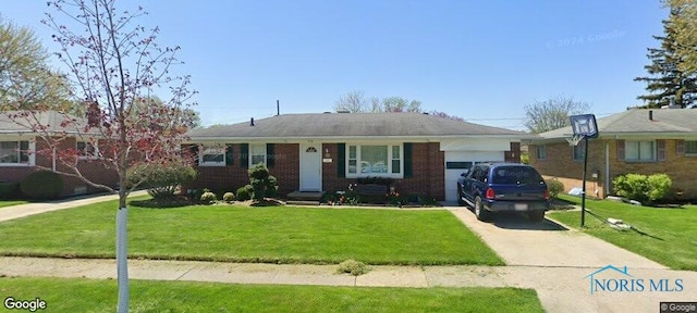view of front of home with an attached garage, brick siding, driveway, and a front yard