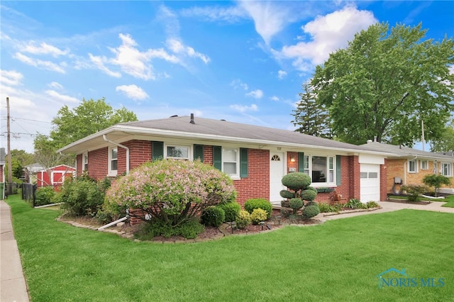 1137 Rosedale St, Maumee, OH 43537 - single story home featuring an attached garage, brick siding, a front lawn, and concrete driveway