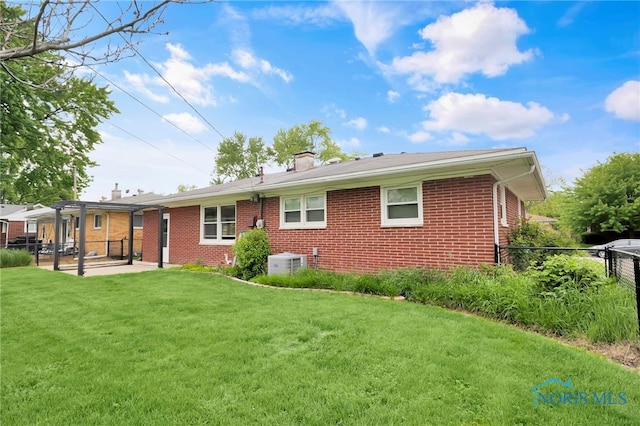 1137 Rosedale St, Maumee, OH 43537 - back of house featuring brick siding, a patio area, cooling unit, and a chimney